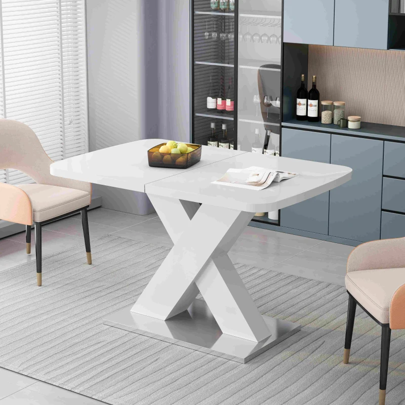 White square dining table with X-shaped pedestal base in stylish room.