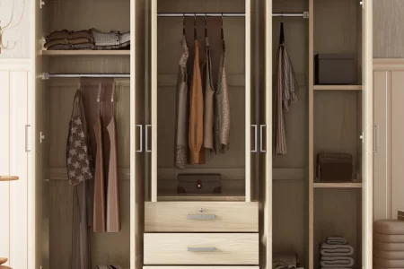 Wooden wardrobe with hanging clothes, folded garments, and storage drawers.
