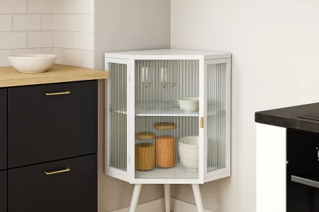 Corner cabinet storing jars, bowls, and glassware neatly.