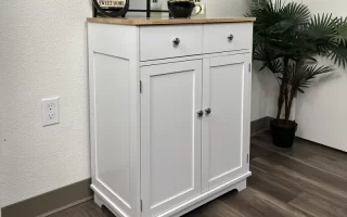 White storage cabinet with two drawers and doors.