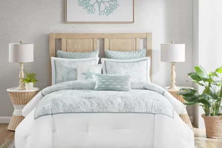 Cozy bedroom with decorative pillows and bedding.