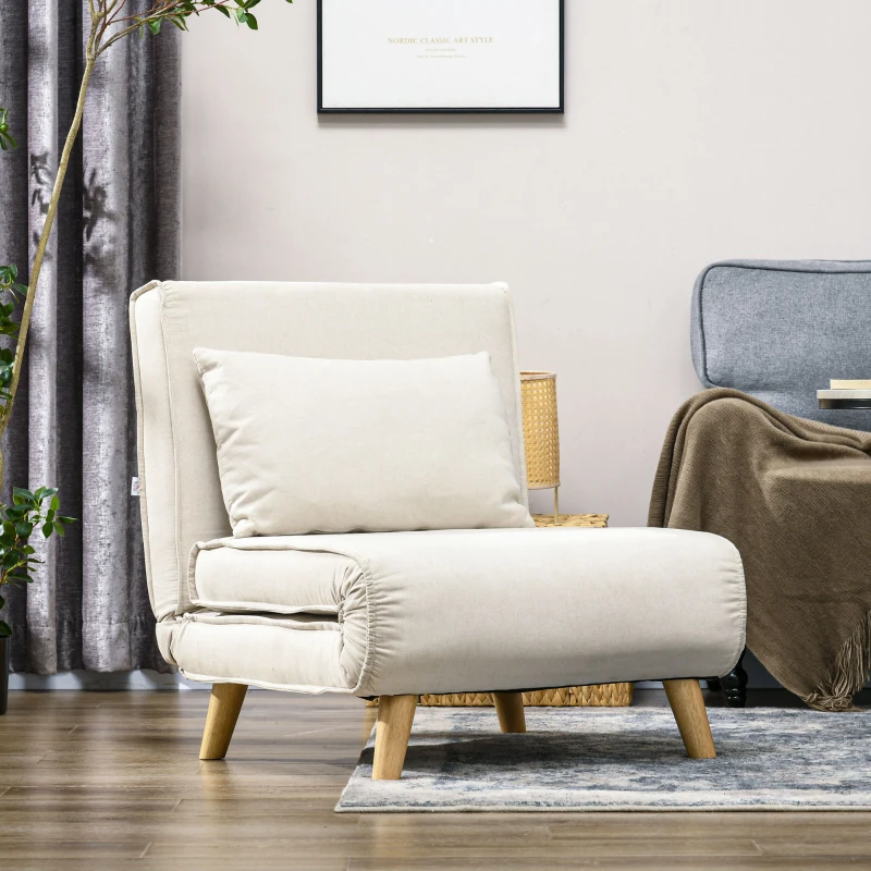 Cream foldable futon chair with wooden legs and cushion, styled with neutral decor and framed art.