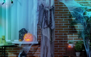 Outdoor Halloween display with ghost, skeleton, bat, and lights secured safely for damage-free setup.