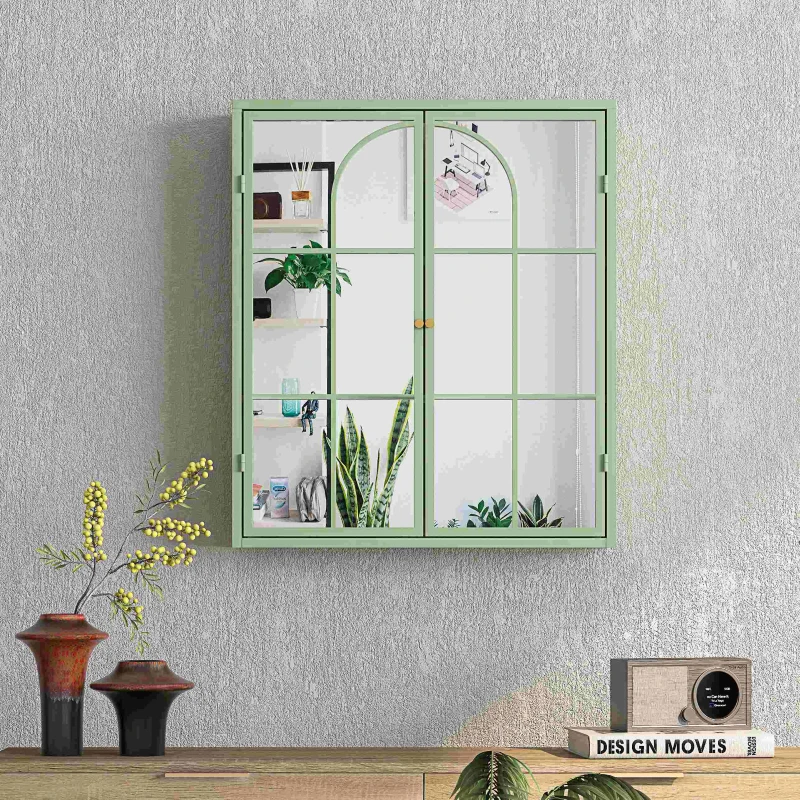 Green framed mirrored wall cabinet reflecting plants and shelves