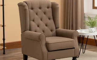 Brown accent chair with wooden legs beside round table.