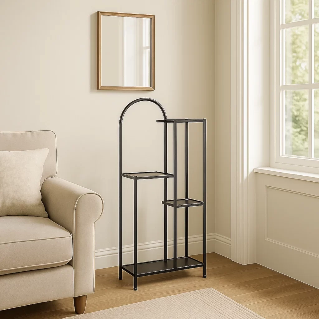 Empty black metal plant stand near beige sofa and window.
