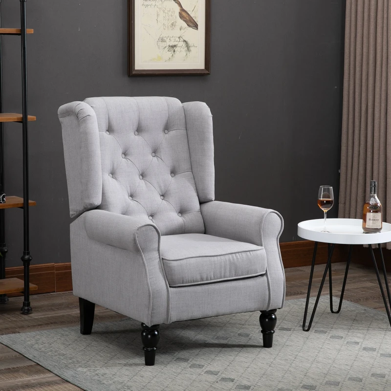Light grey accent chair with rolled arms in dark room.