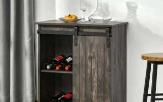 Gray wine cabinet with sliding barn doors and glass decanter.