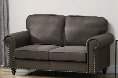 Dark gray fabric loveseat with nailhead trim in living room