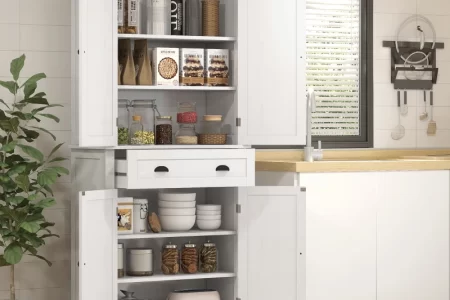 White cabinet with organized shelves of food jars and bowls