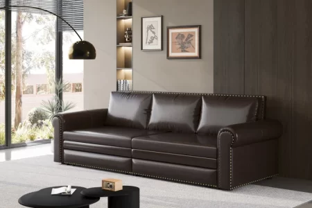 Dark leather sofa with brass stud details in modern living room