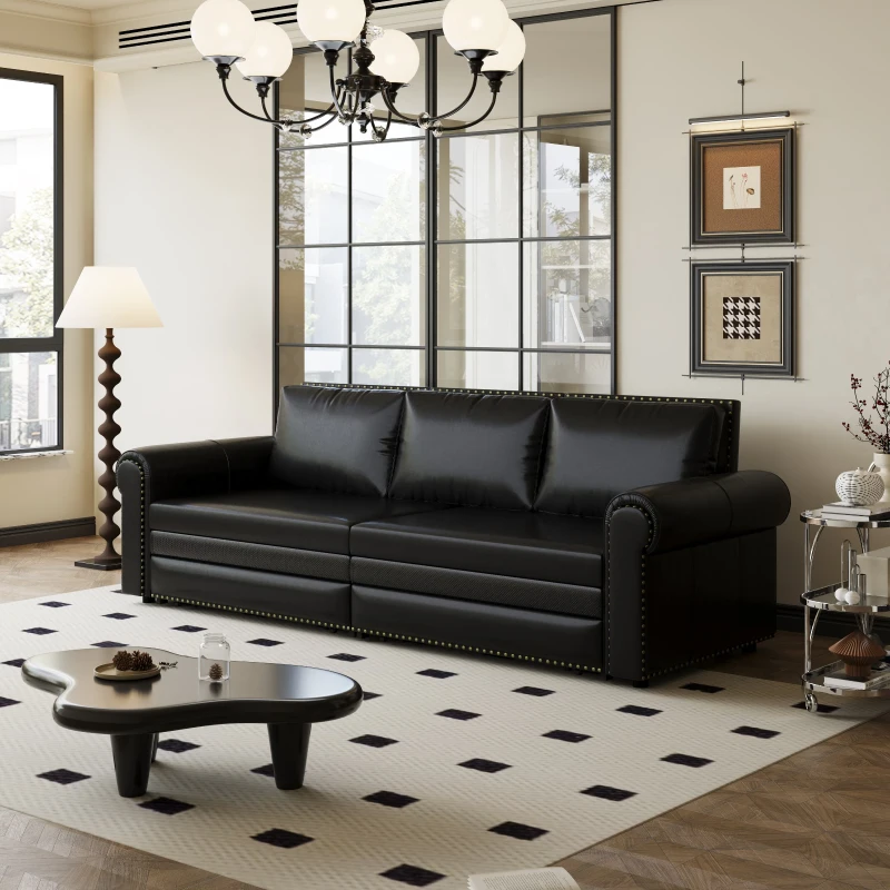 Black leather sofa in modern living room with rug.