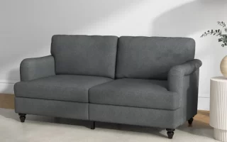 Dark gray upholstered sofa in modern living room setup
