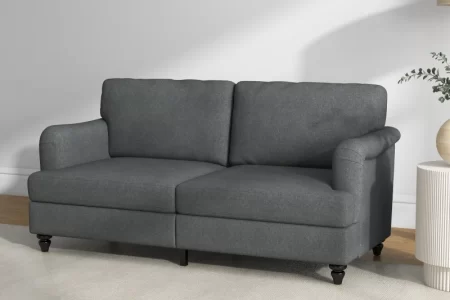 Dark gray upholstered sofa in modern living room setup