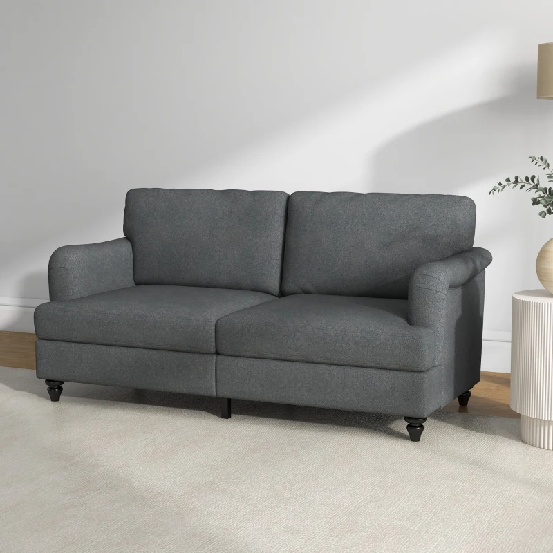 Dark gray upholstered sofa in modern living room setup