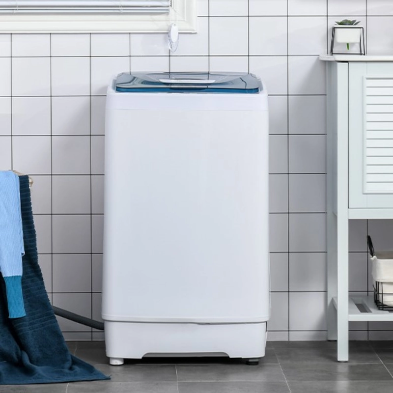 Portable washing machine in laundry area of a house. 