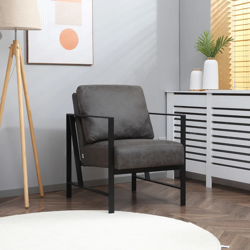 Black frame accent chair with grey cushions in modern interior.