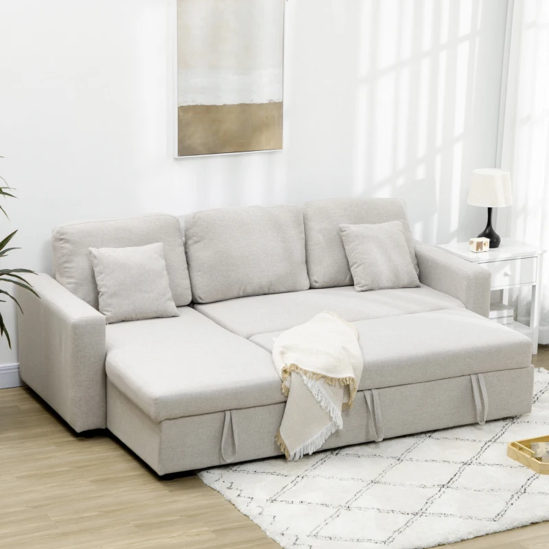 Light gray L-shaped sectional sofa bed with pillows
