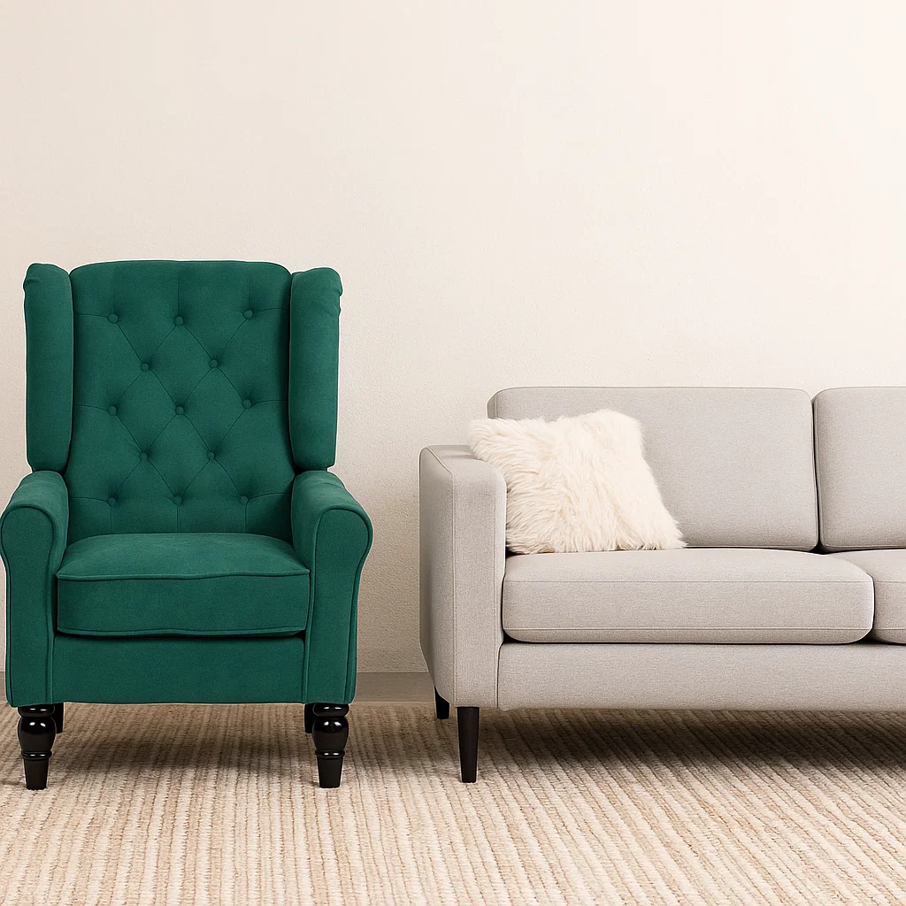 Green wingback armchair beside light grey sofa with cushion