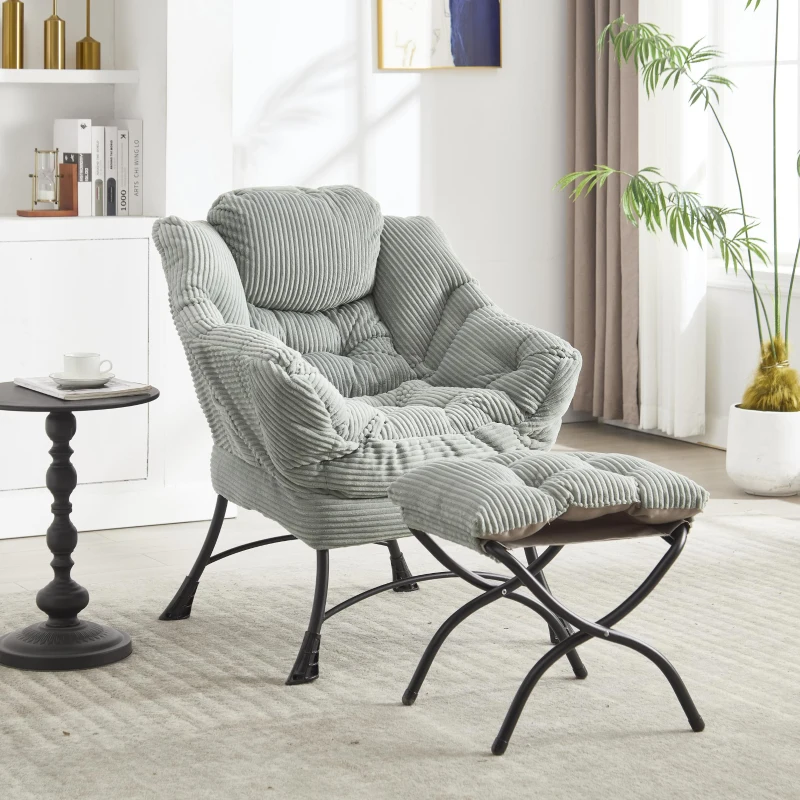 Grey padded chair with ottoman in bright living space.