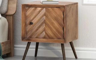 Wooden cabinet with chevron door and angled metal legs.
