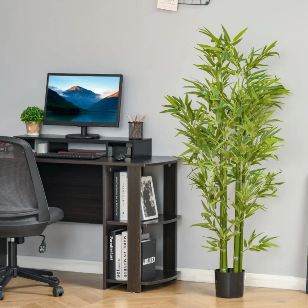 Empty black decorative planter positioned near desk in home office, ready for potting.