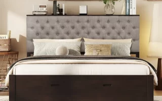 Upholstered bed with storage drawers beneath frame in stylish bedroom.
