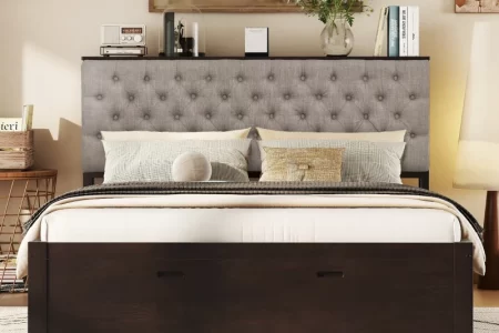 Upholstered bed with storage drawers beneath frame in stylish bedroom.