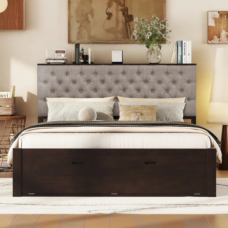 Upholstered bed with storage drawers beneath frame in stylish bedroom.