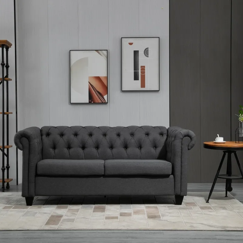 Gray tufted sofa placed in modern living room.