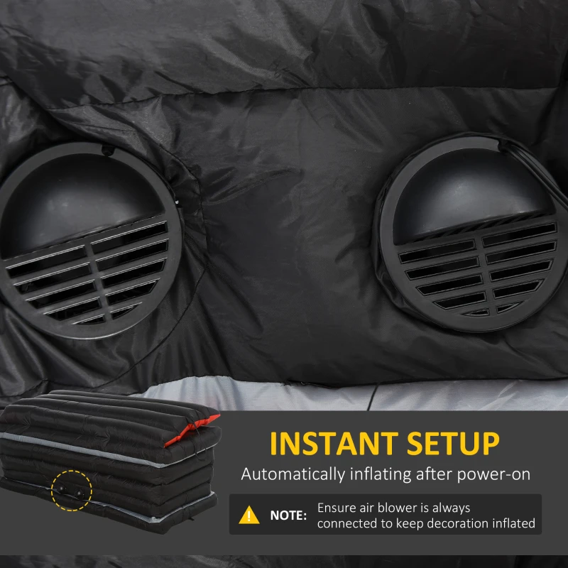 Close-up of dual air blowers inflating Halloween coffin decoration automatically after power connection.
