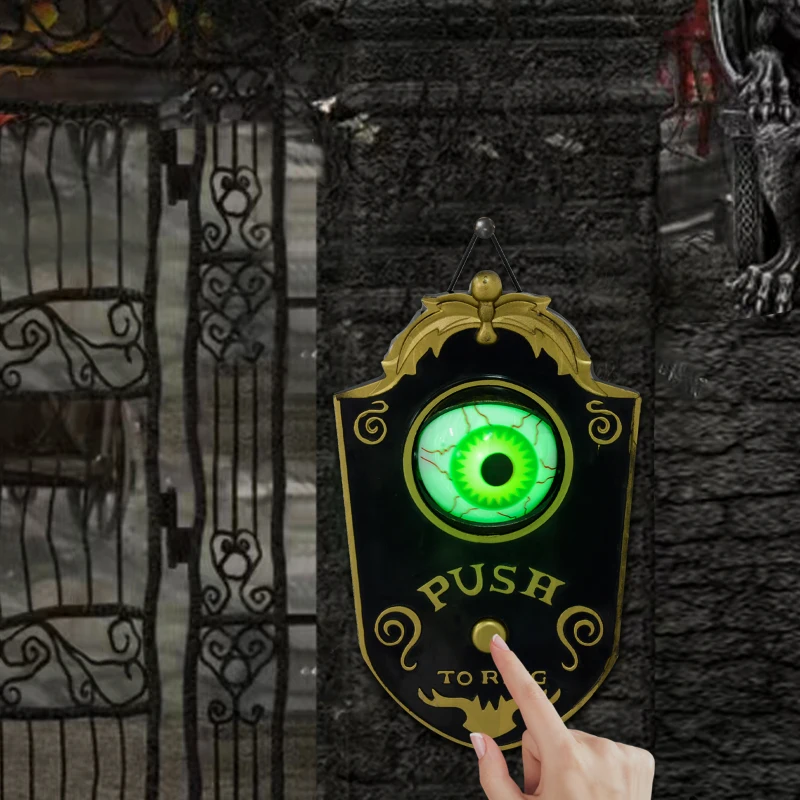 Creepy green glowing eyeball doorbell with finger pressing button.
