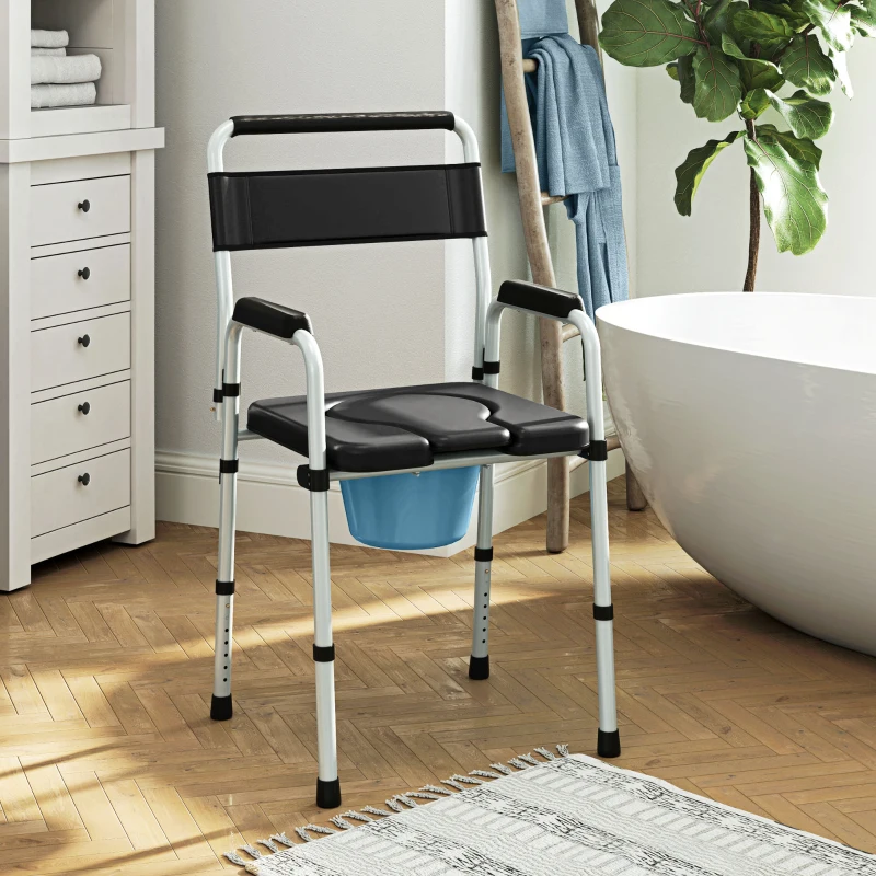 Commode chair with padded seat and bucket placed in bathroom.