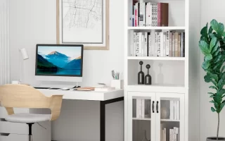 White office hutch cabinet organized with monochrome books and minimalist black and white decor.