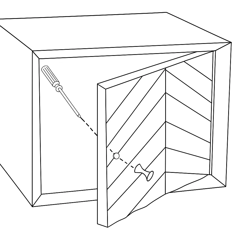 Screwdriver attaching round knob to cabinet door front.
