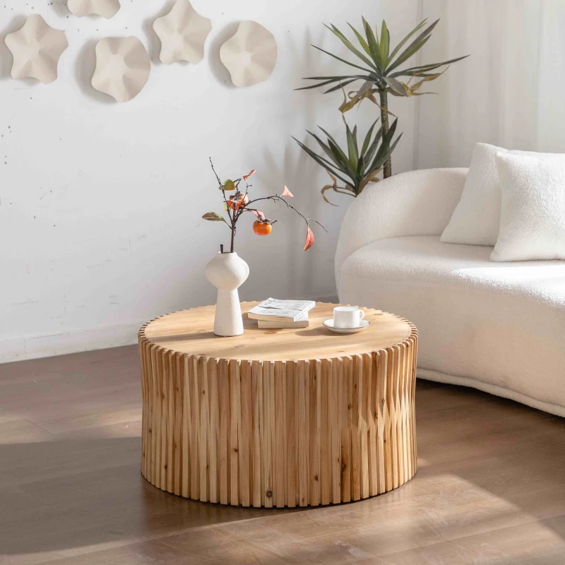 Round wooden coffee table with vase and cup