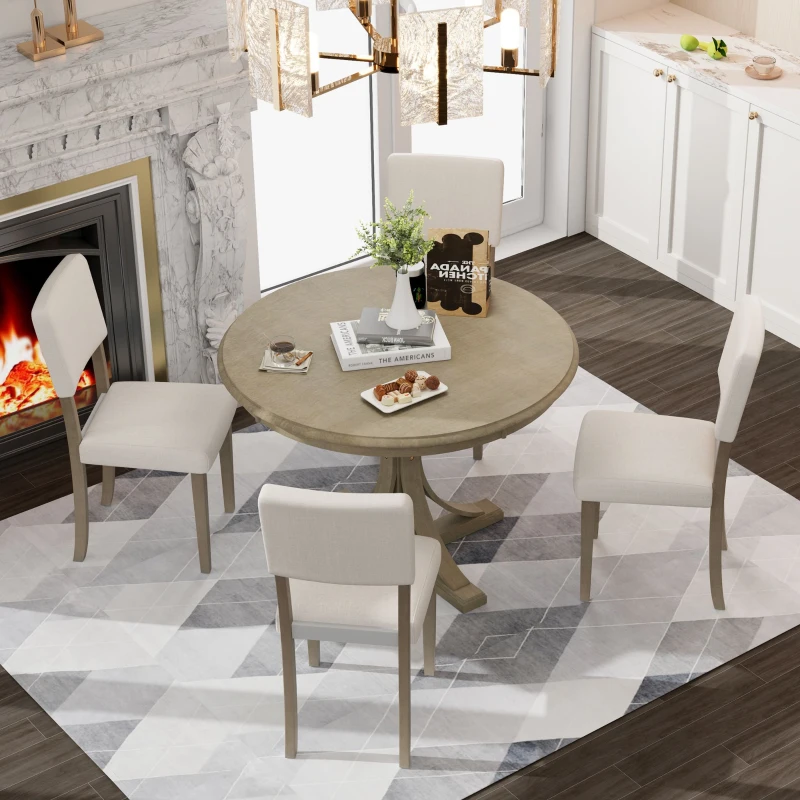Round wooden dining table with beige upholstered chairs indoors.
