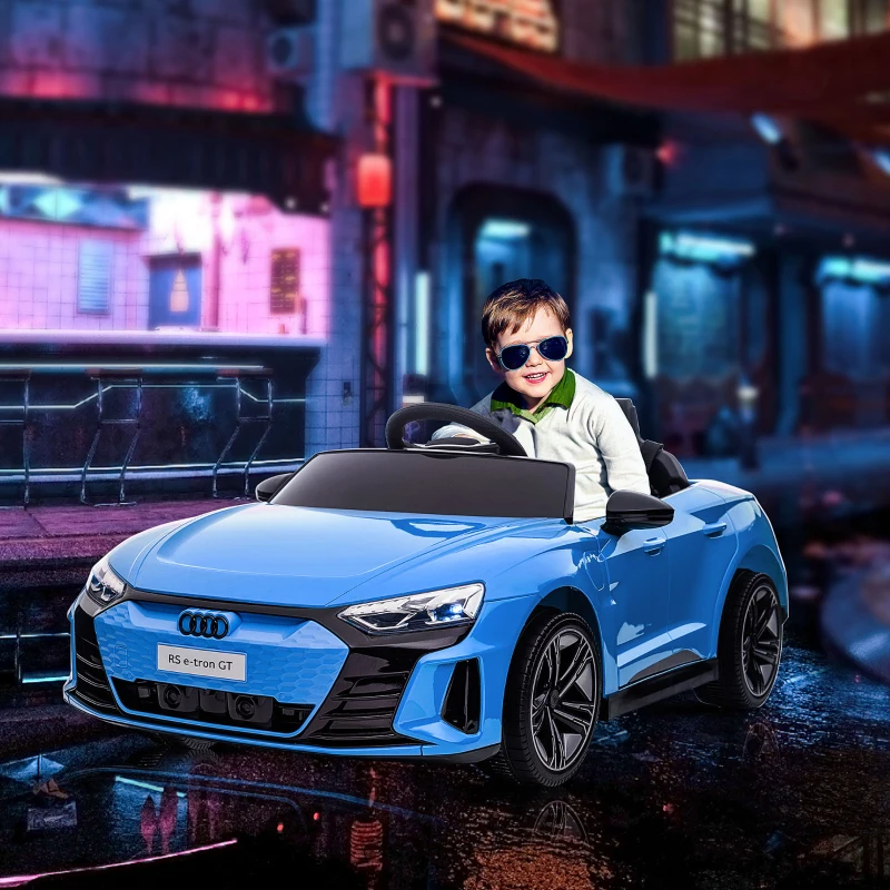 Boy driving blue electric sports car toy at night