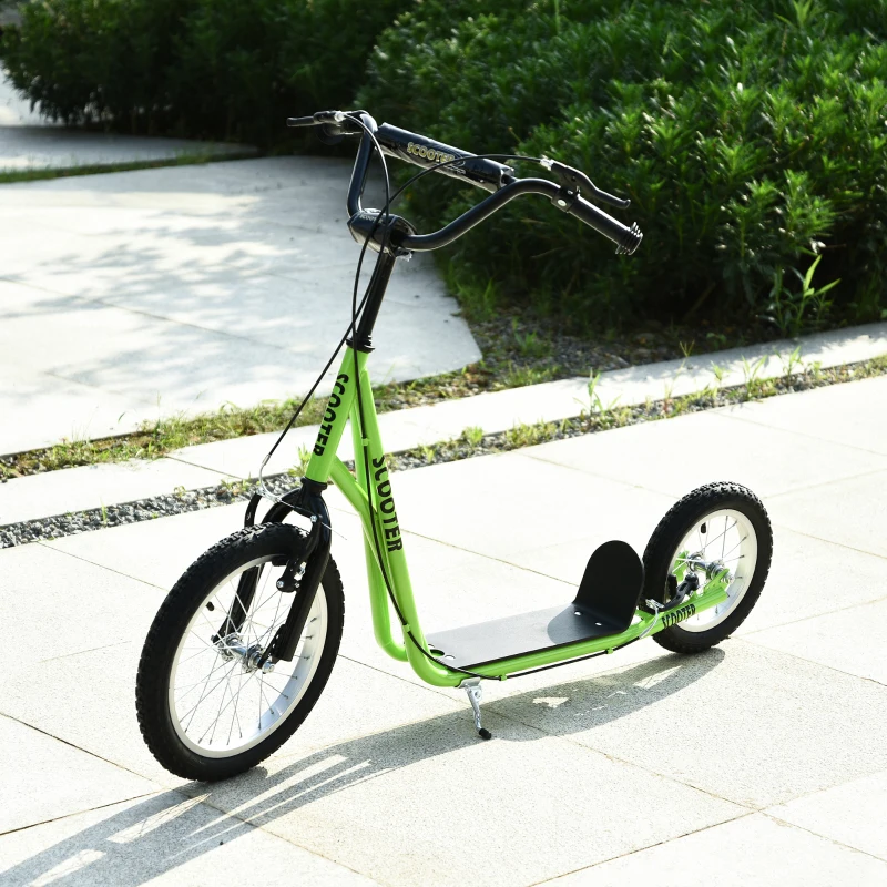 Green kick scooter with large tires on pathway