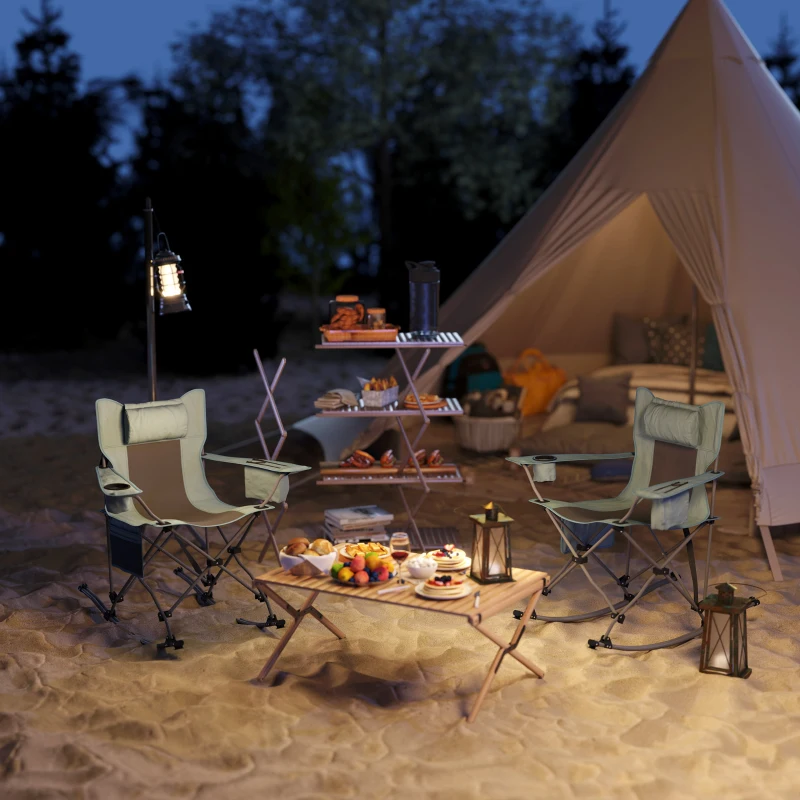 Camping chairs arranged near tent with lanterns and food setup