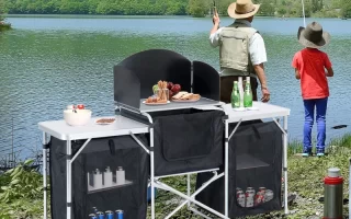 Two people fishing near a camping table setup.