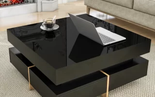 Glossy black square coffee table with laptop