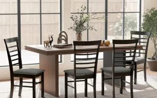 Spacious dining room with wooden table and four ladder-back chairs