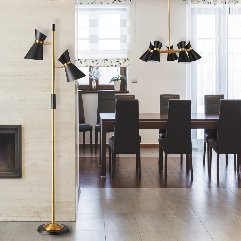 Gold and black floor lamp next to dining table and chairs
