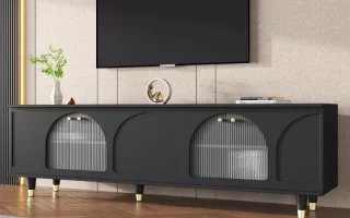 Stylish black TV stand with glass doors and golden handles.