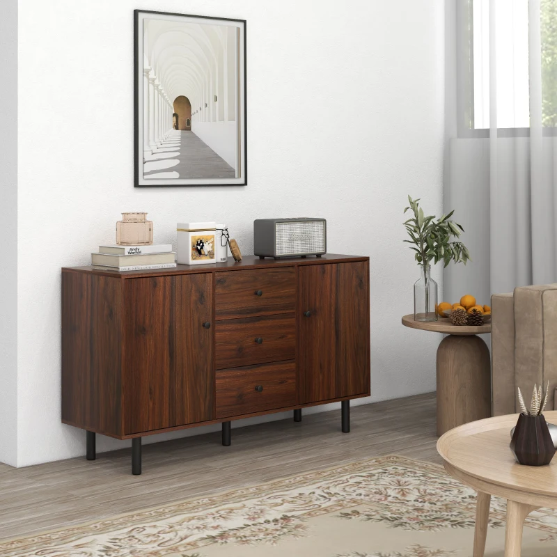 Mid-century sideboard with books, decor items, and framed wall art.