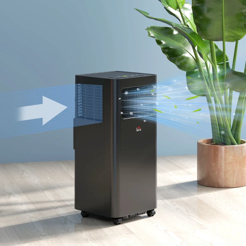 Black portable air conditioner blowing cool air near plant.