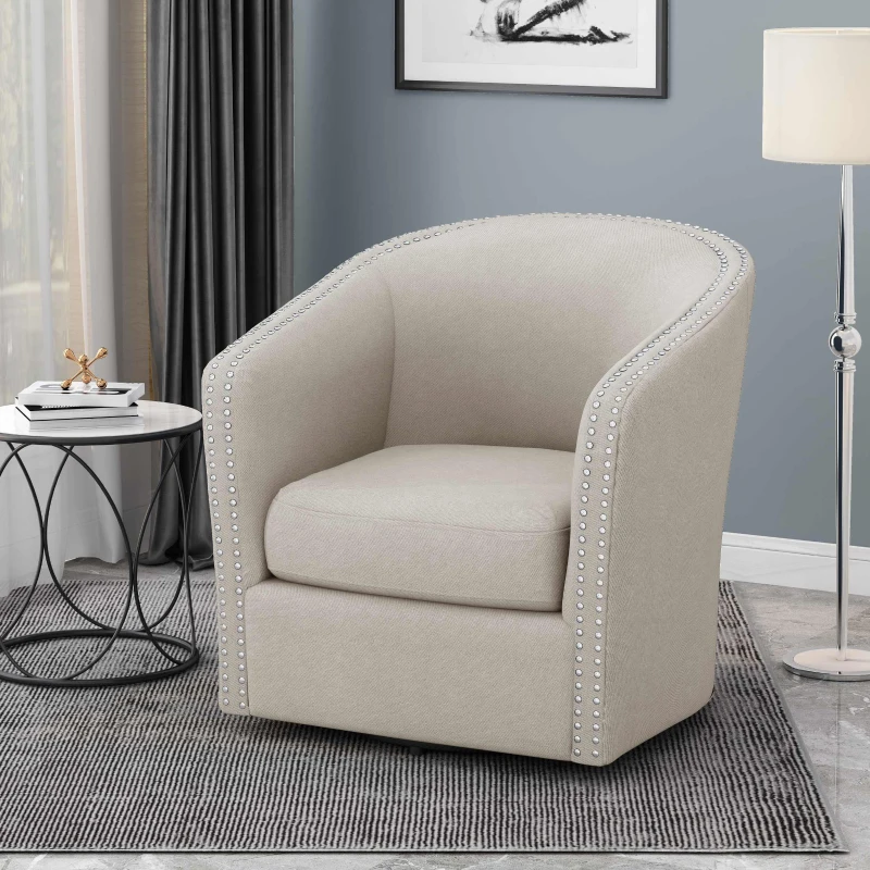 Gray armless slipper chair beside modern sofa and round metal table.