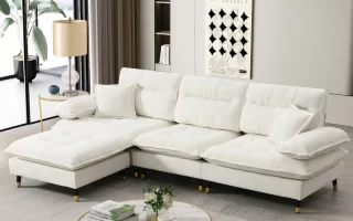 Modern white sectional sofa with cushions in stylish living room setup