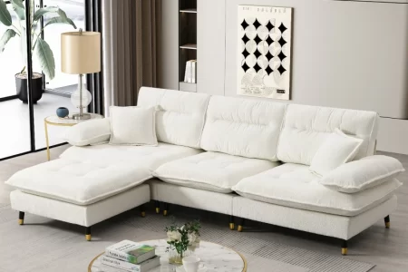 Modern white sectional sofa with cushions in stylish living room setup